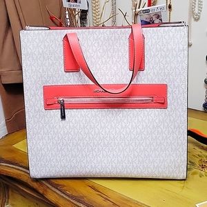 Michael Kors Tote bag 13.5 in high, 14 in wide, snap closure